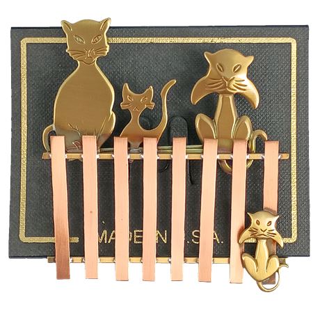 Whimsical Copper Cat Brooch Featuring Three Felines