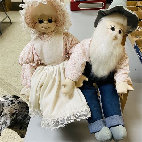 Large Dolls on Wood Bench