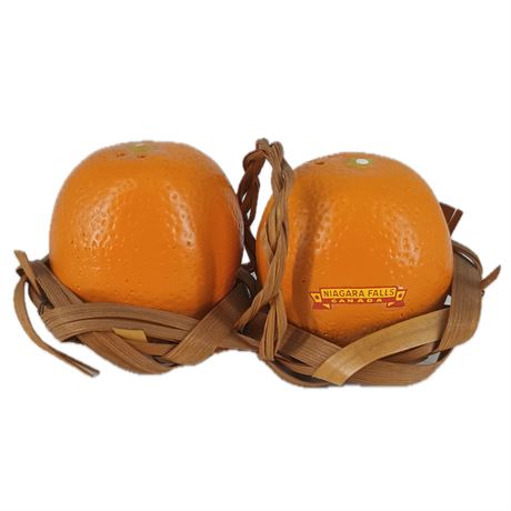 Orange Salt and Pepper Shakers in Basket Holder