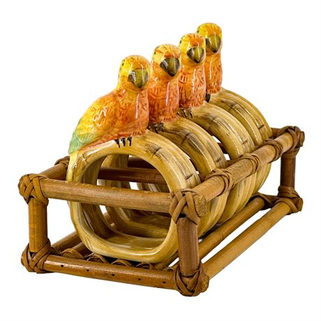 Four Vintage Parrot Ceramic Napkin Rings in a Rattan Carrier