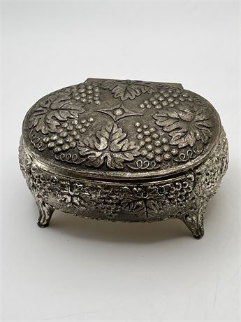 Vintage silver clad ornate footed trinket box