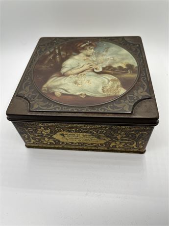 Vintage metal box filled with buttons
