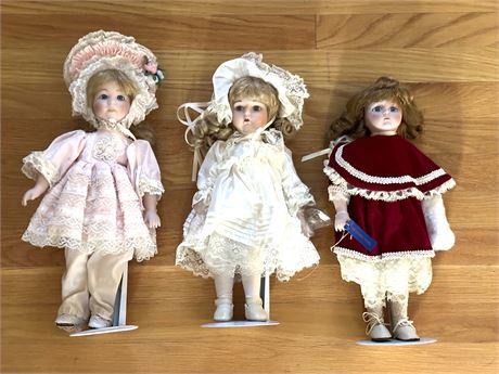 Three Porcelain/Cloth  Dolls on Stands
