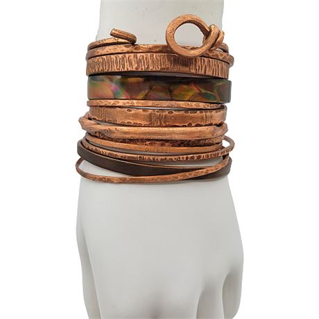 Twelve Artisan Made Copper Cuff Bracelets