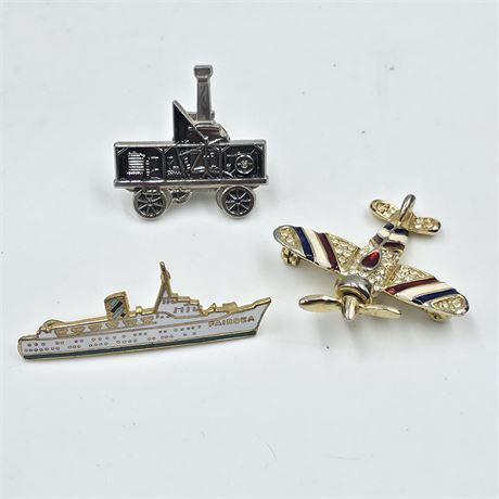 Ship, Steam engine, and airplane brooch lot