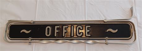 Vintage office sign hanger above the door