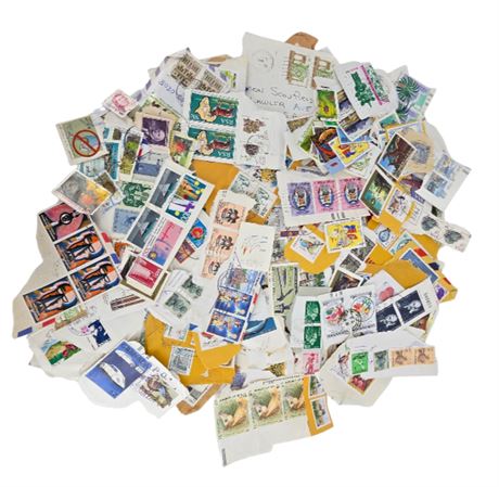 Lot of Foreign Stamps--Still attached to envelopes