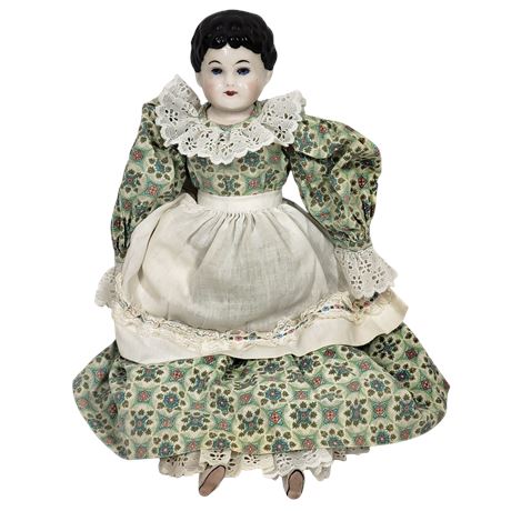 Vintage Porcelain Doll in Green Dress