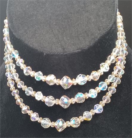 Three strand iridescent cased bead necklace