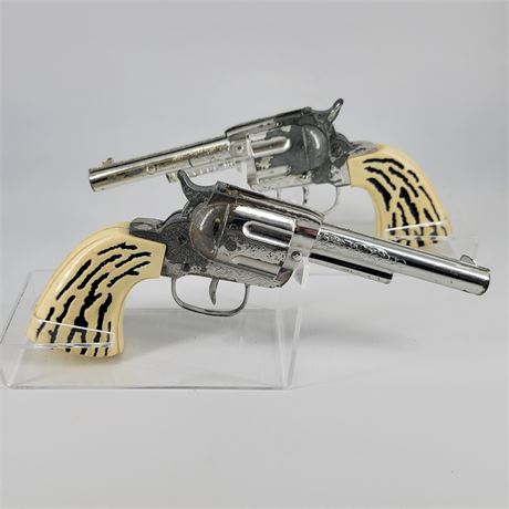 Pair of Vintage Revolver Cap Guns Chrome with Ivory Grips w/ Floral Holster