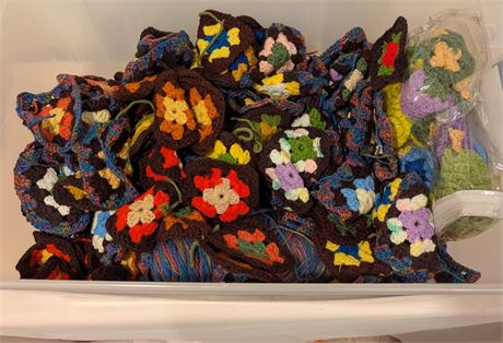 Lot of crochet pieces in storage container