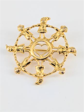 Gold tone Pin Children holding hands around a heart