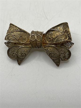 Filigree vintage silver bow brooch