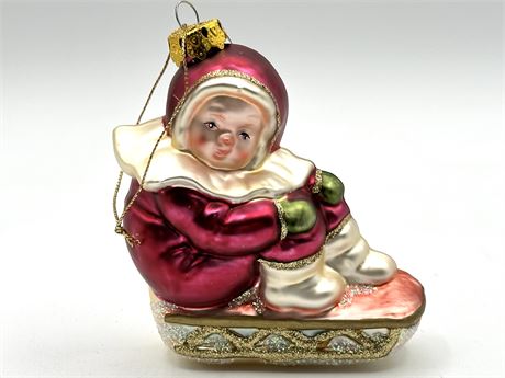 Child on Sled Glass Ornament