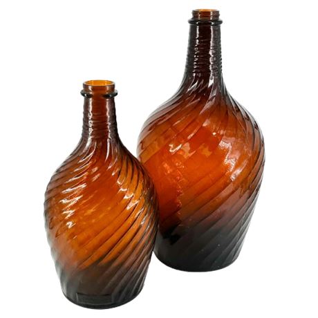Pair of 1940's Duraglas Amber Swirl Glass Bottles