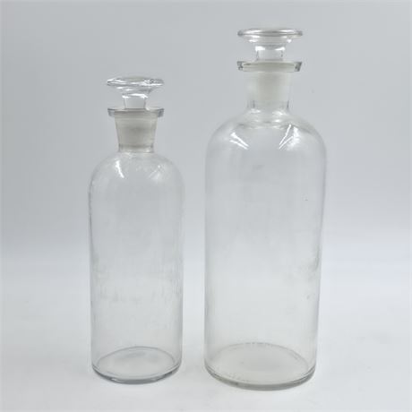 Antique apothecary bottles with frosted glass stoppers