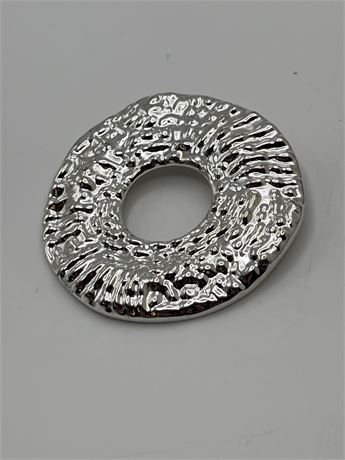 Large, heavy polished metal disc pendant