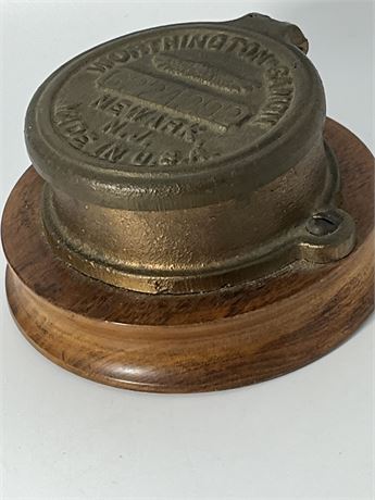 Vintage Worthington, new Jersey, official water meter cap on wooden ba