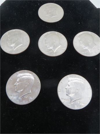 One 1984 D, Three 1985 D & Two 1986 D Kennedy Half Dollars