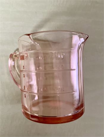 Pink depression, measuring cup