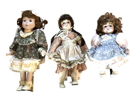 Three Porcelain/Cloth Dolls on Stands