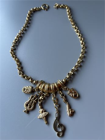 Goldtone linked musical instruments, charm necklace