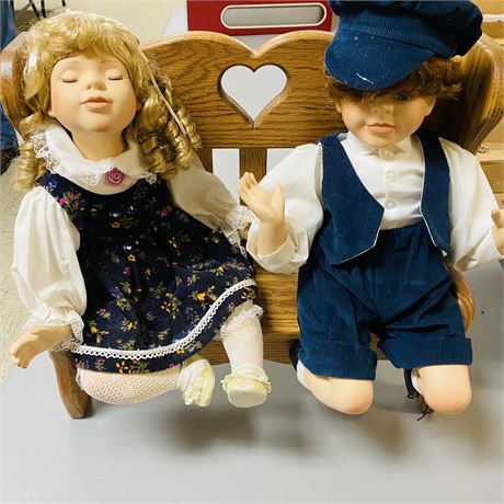 Large Dolls on Wood Bench