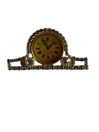 Vintage mantel clock with rhinestone brooch
