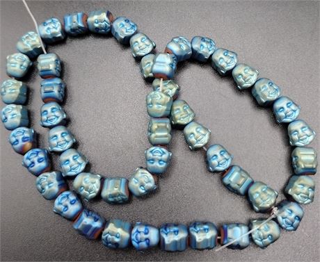 Blue/green Buddha head beads 15 in strand