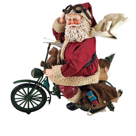 Clothtique Santa Riding a Bicycle by Possible Dreams