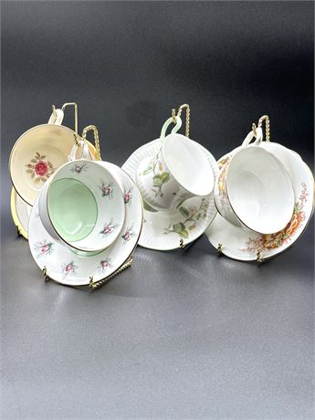 Four Teacups and Stands