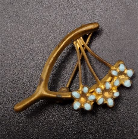 Gold tone blue enamel wishbone floral brooch