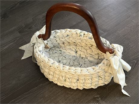 Collectible woven cloth basket with wooden handle