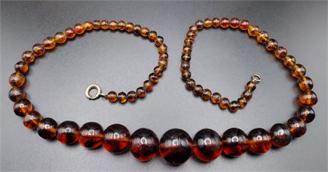 Amber color swirl graduated bead necklace 20 in